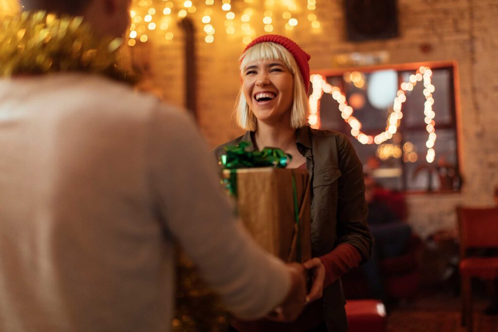 A couple exchanging a gift box.